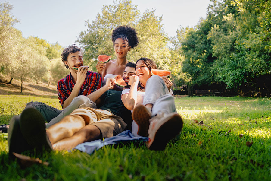 happy-friends-at-picnic-thinking-about-teeth-straightening-options